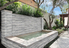 Close-up of Alaska Gray 3D Honed stacked stone panel showing marble texture and white veining