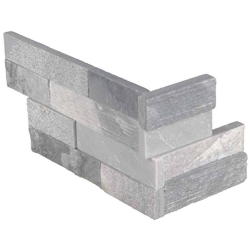 Flat lay of Alaska Gray Multifinish corner panels with textured marble surfaces