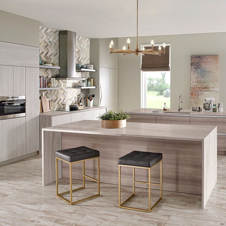 Angora Marble Herringbone tile installed as a backsplash in a neutral kitchen
