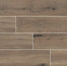 Flat lay of Antoni Café 6x36 porcelain tile showing realistic wood grain texture