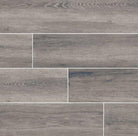 Flat view of Antoni Gris 6x36 wood-look porcelain tile in weathered gray with matte finish