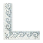 Close-up of blue Greek wave motif on Carrara marble border 4x12