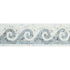 Close-up of blue Greek wave motif on Carrara marble border 4x12