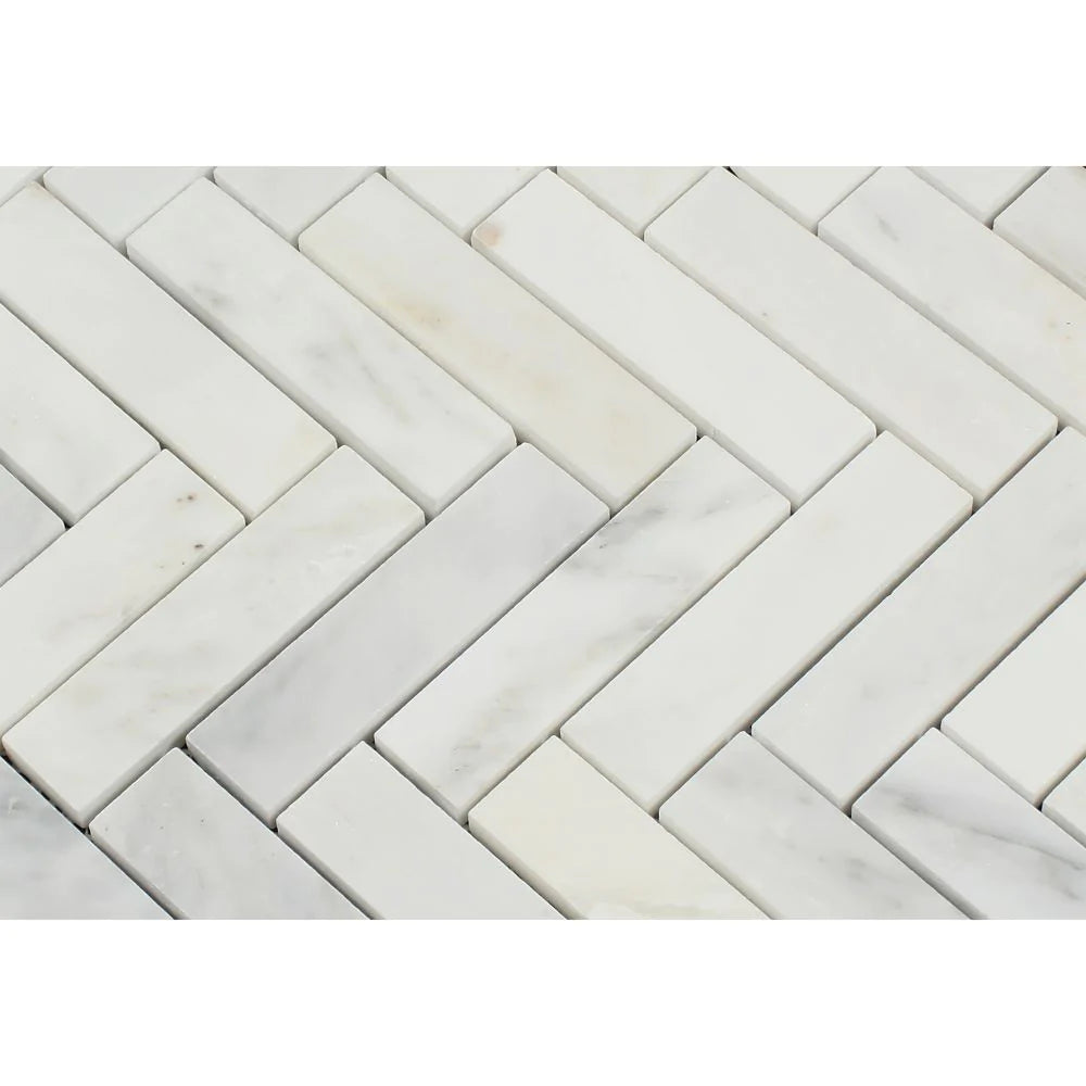 Close-up of Arabescato Carrara 1x4 Herringbone Mosaic showing white and gray veining