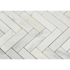 Close-up of Arabescato Carrara 1x4 Herringbone Mosaic showing white and gray veining