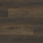 Flat lay view of Barrel luxury vinyl plank flooring in deep chocolate brown with wood grain detail