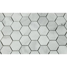 Close-up of Bianco Mare marble hex tiles showing soft gray veining