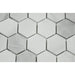 Close-up of Bianco Mare marble showing 2x2 hexagon pattern and natural veining