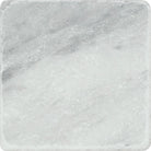 Close-up of Bianco Mare Marble Tile showing tumbled texture and gray veining