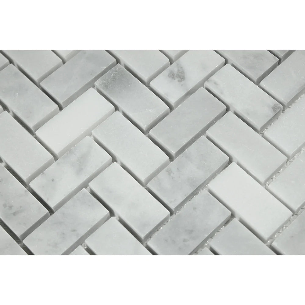 Close-up of Bianco Mare marble showing polished herringbone pattern
