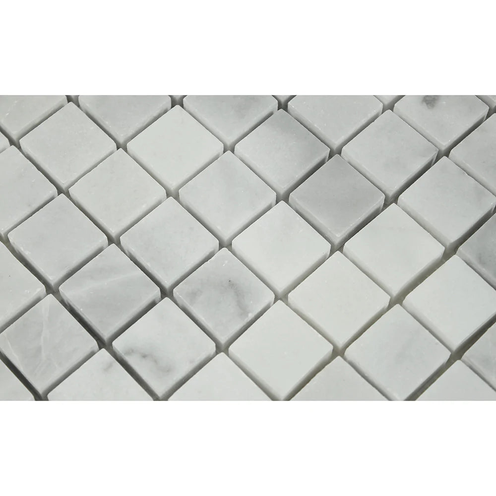 Close-up of Bianco Mare 1x1 mosaic showing polished surface and subtle veining
