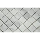 Close-up of Bianco Mare 1x1 mosaic showing polished surface and subtle veining