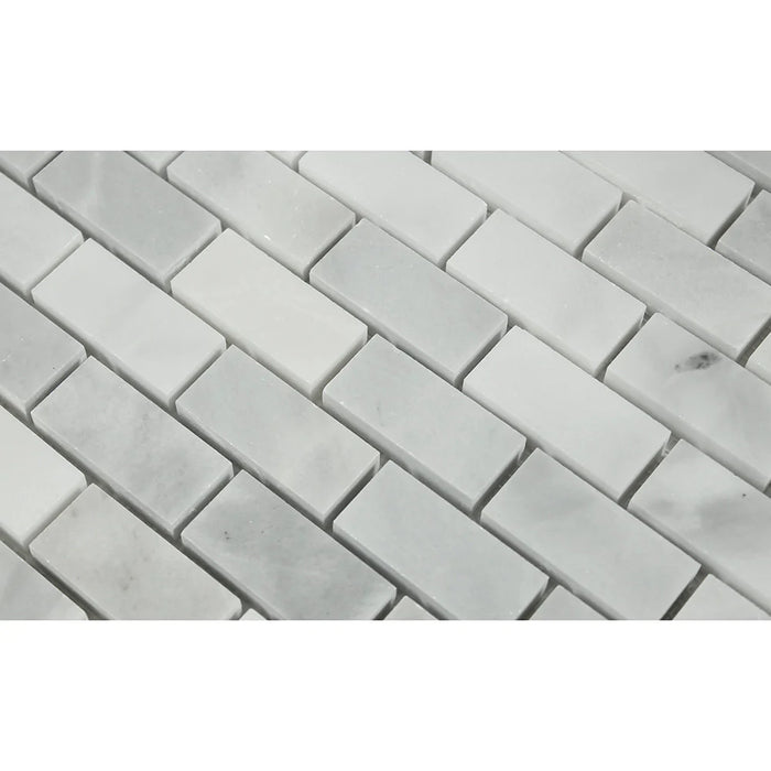  Close-up of Bianco Mare 1x2 mosaic showing polished marble surface and natural veining