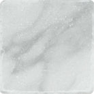 Close-up of 4x4 Bianco Mare Marble highlighting tumbled texture and matte finish