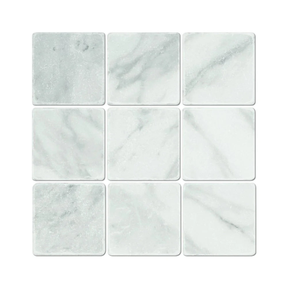 Flat view of Bianco Mare Marble Tumbled Tile in 4x4 size, showing soft beige and ivory tones