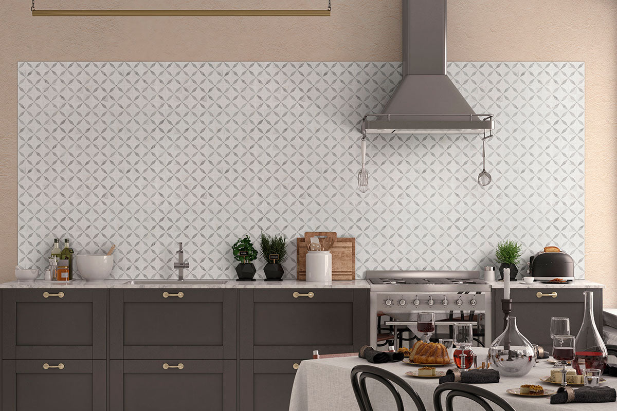 Close-up detail of Bianco Starlight mosaic showing waterjet-cut star design in polished marble