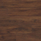Flat lay of Braly luxury vinyl tile showing warm red-brown tones with wood knots and matte finish