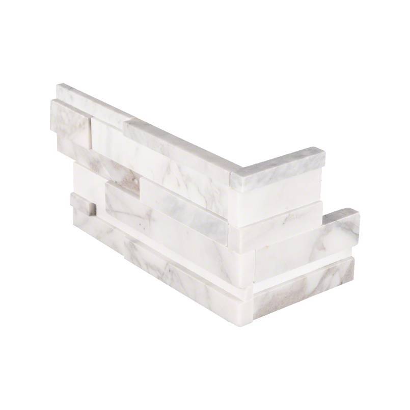 Flat lay of Calacatta Cressa 3D marble corner panel with white and gray veining