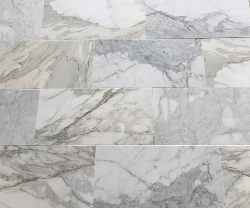 Calacatta Gold 12x24 marble tiles installed on bathroom or kitchen wall