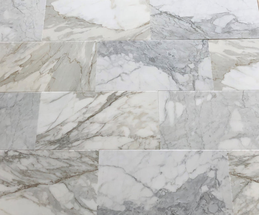 Calacatta Gold 12x24 marble tiles installed on bathroom or kitchen wall