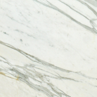Close-up of Calacatta Gold Marble showing rich gold veining on white background
