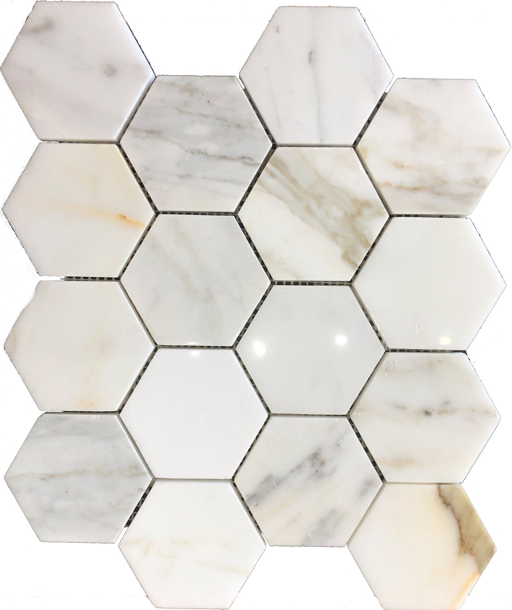 Close-up of Calacatta Gold 3-inch hex tile showing veining and polished surface
