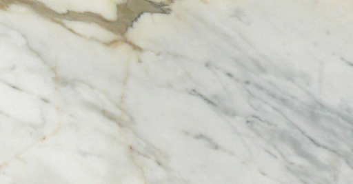 Close-up of Calacatta Gold 6x12 marble tile showing bold veining