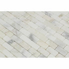 Close-up of Calacatta Gold Marble showing mini brick pattern and polished surface