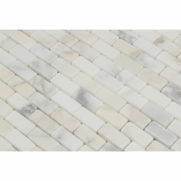 Close-up of Calacatta Gold Marble showing mini brick pattern and polished surface