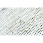 Close-up of Calacatta Gold Bamboo Sticks showing linear pattern and veining