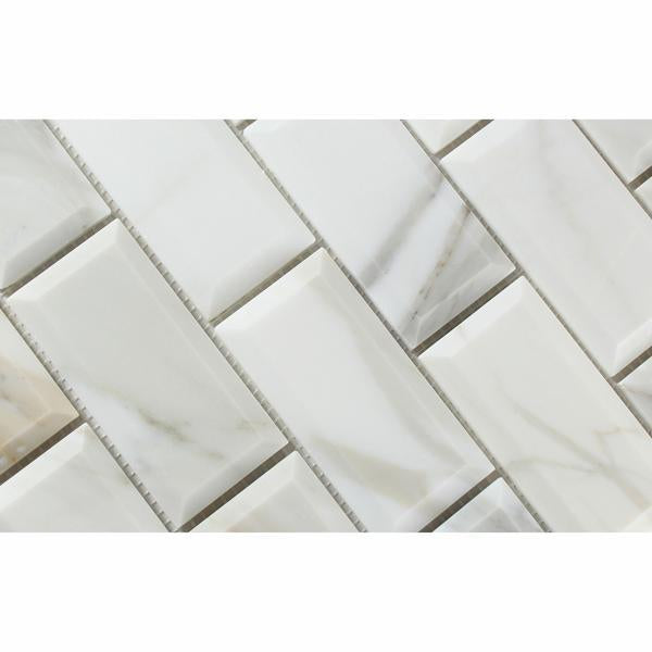 Close-up of Calacatta Gold marble showing deep beveled edge and gold veining
