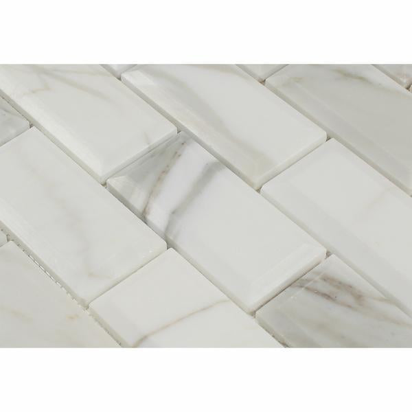 Close-up of Calacatta Gold marble showing deep beveled edge and gold veining