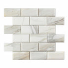 Flat view of Calacatta Gold Deep Bevelled Subway Tile in 2x4 format, polished finish