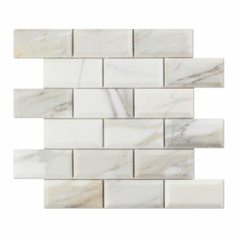 Flat view of Calacatta Gold Deep Bevelled Subway Tile in 2x4 format, polished finish