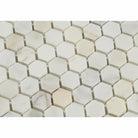 Close-up of 1" hexagon tile showing gold veining and polished surface