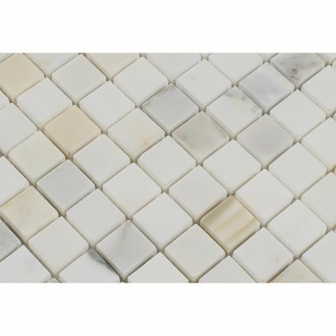 Close-up of Calacatta Gold 1x1 tile showing detailed veining and finish