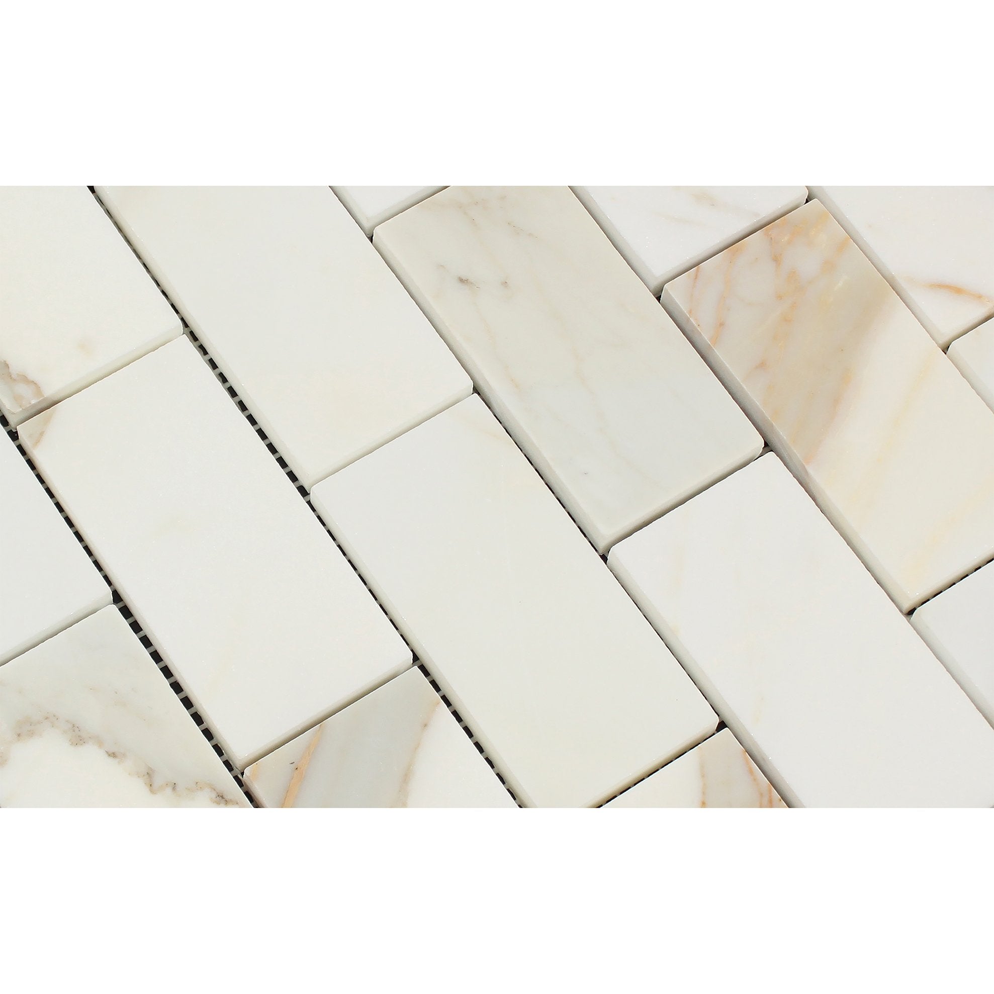 Close-up of Calacatta Gold 2x4 mosaic tile showing polished surface and veining