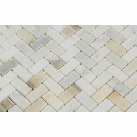 Close-up of Calacatta Gold marble showing herringbone layout and fine veining
