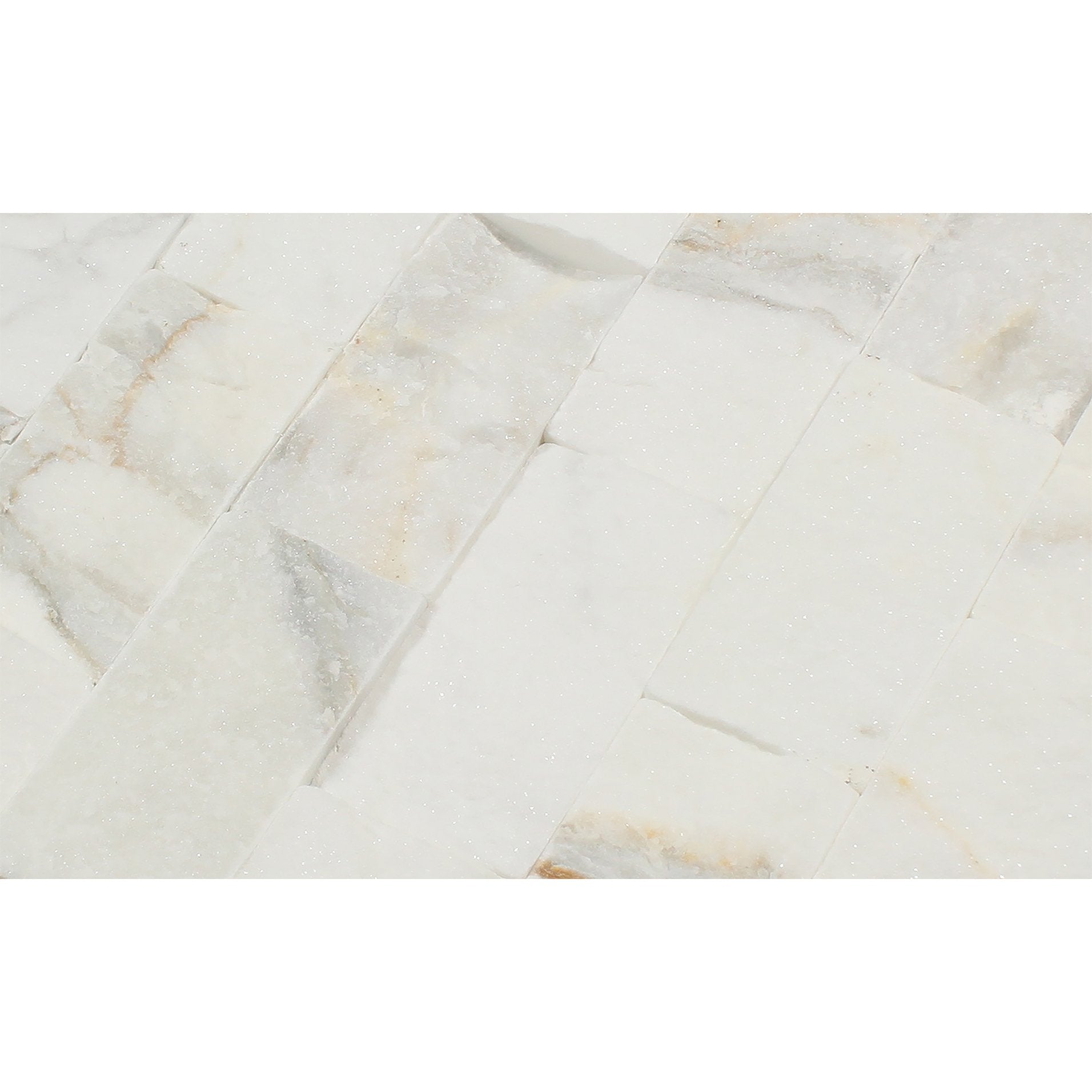 Close-up showing chiseled texture and golden veining of Calacatta Gold Splitface Marble