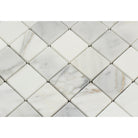 Close-up of Calacatta Marble mosaic tile showing detailed veining and polished surface
