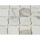 Close-up of Calacatta Marble Lantern mosaic showing bold veining and polished texture