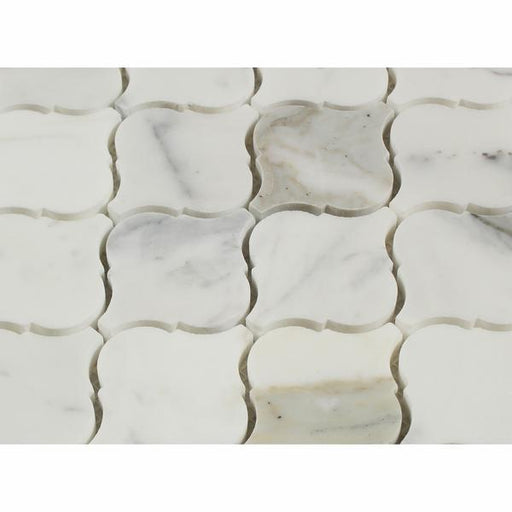 Close-up of Calacatta Marble Lantern mosaic showing bold veining and polished texture