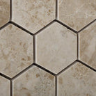 Close-up of Cappuccino marble hexagon mosaic showing polished texture and warm tones