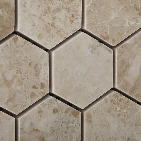 Close-up of Cappuccino marble hexagon mosaic showing polished texture and warm tones