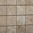 Close-up of polished Cappuccino marble mosaic tile showing texture and color variation