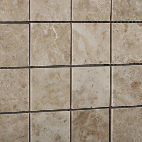 Close-up of polished Cappuccino marble mosaic tile showing texture and color variation