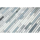 Detail of Carrara white marble veining and blue glass mosaic inserts