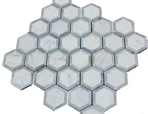Detail of Carrara marble hex tiles with polished blue glass inserts