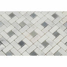 Detail of Carrara pinwheel mosaic tile featuring polished blue inserts