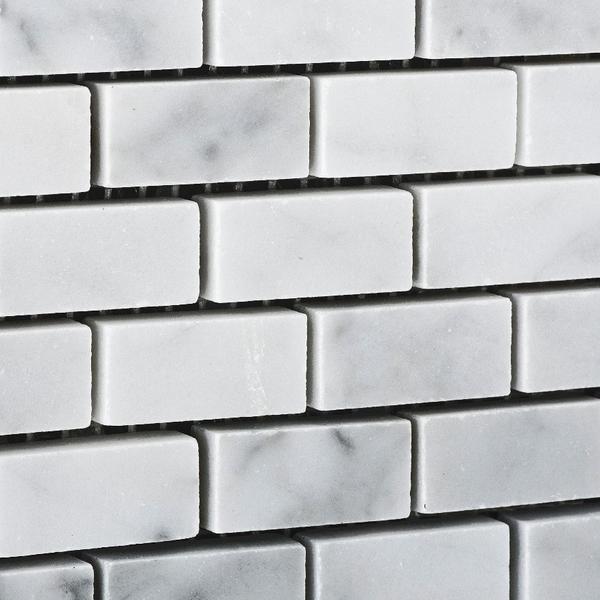 Close-up of Carrara mini brick pattern with polished finish